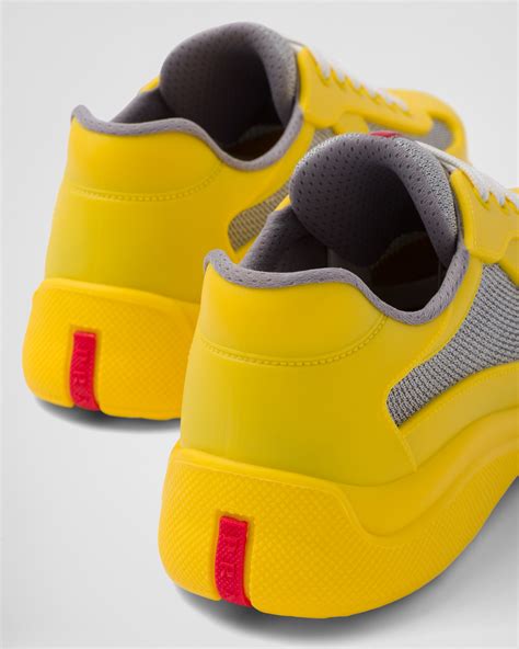 yellow and white prada sneakers.